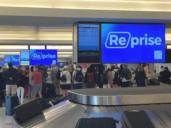 Reprise B2BMX 2022 Campaign - baggage claim digital signage